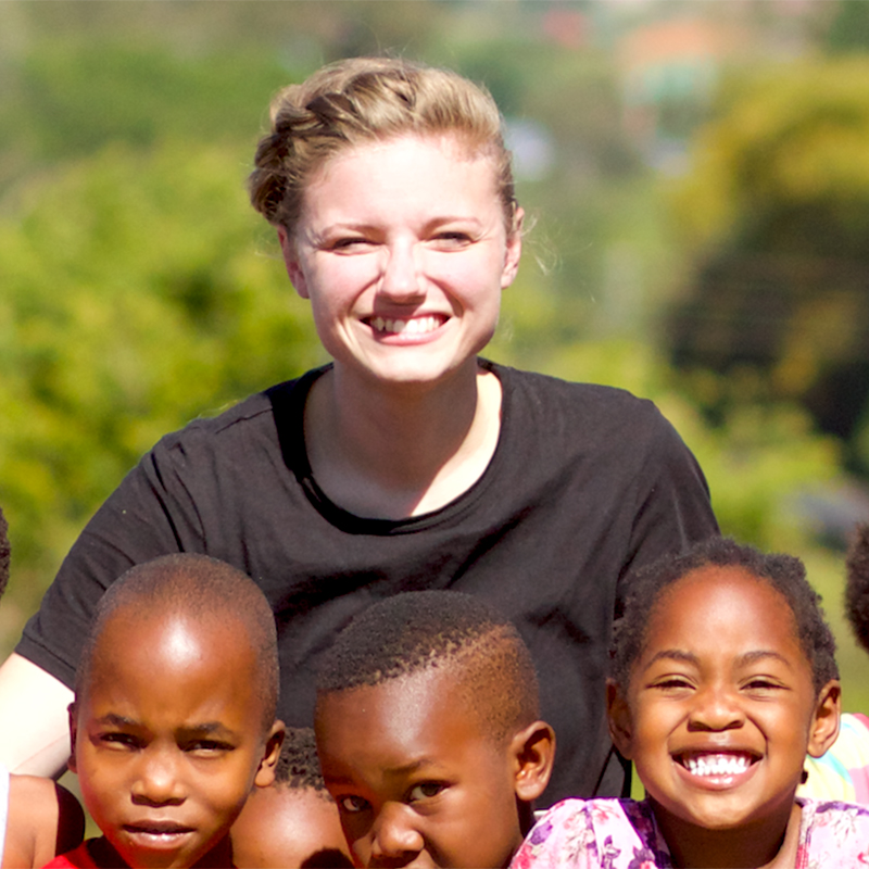 Picture of Cailey Hart with a group of kids